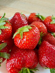 Ripe strawberries close-up on a plate