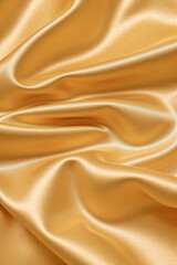 Obraz premium yellow golden silk satin fabric background