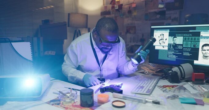 Man, investigation and gun at lab for fingerprints analysis, uv light or exam for evidence. African person, firearm and murder weapon with inspection for proof, police or search for criminal identity