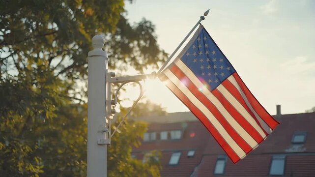 American flag waving proudly in golden sunlight, a symbol of freedom and patriotism, ideal for celebrating national holidays or showcasing core American values in your project