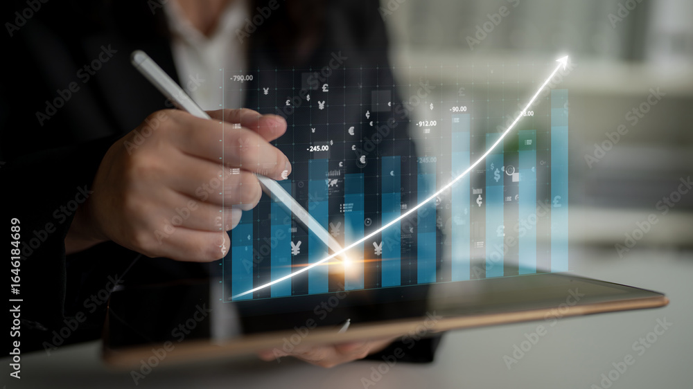Poster a business professional engages in financial analysis using a tablet, highlighting technological adv