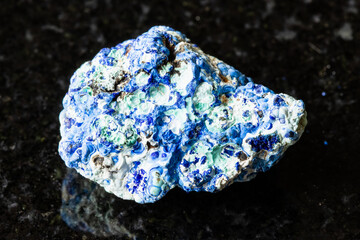 sample of rough azurite and gibbsite rock on black