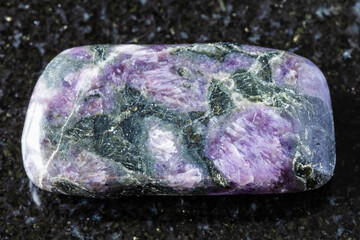 sample of tumbled kataranskite mineral on black