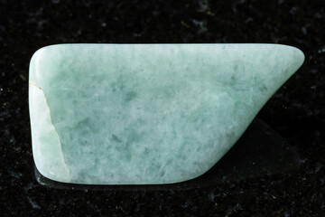 sample of polished jadeite mineral on black