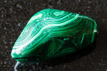 sample of polished malachite mineral on black