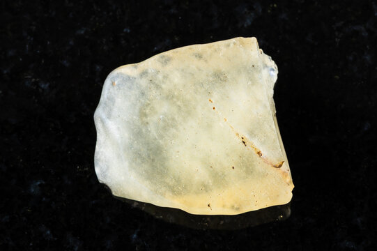 sample of rough libyan desert glass on black