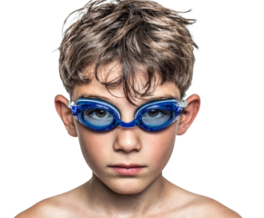 A young swimmer stares intently, wearing blue swimming goggles.