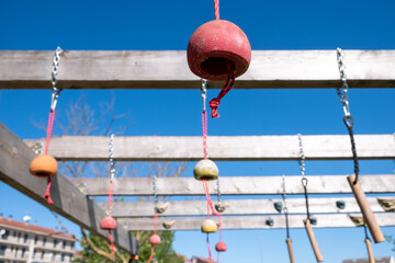 The challenging grips and obstacles of an outdoor gym against a blue sky strength training concept