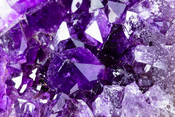 geode of raw amethyst crystals close up