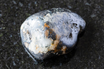 rolled cleiophane and mushketovite rock on black