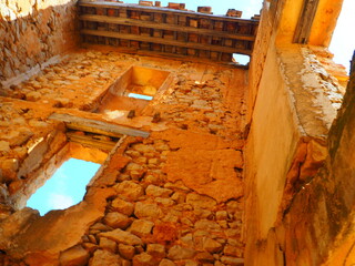 Requena,19th century telegraph tower in Mediterranean countryside, historic communication building under bright blue sky 