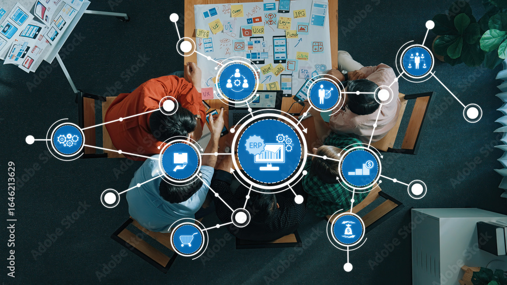 Poster aerial view of professionals collaborating in a modern workspace, utilizing erp software solutions f