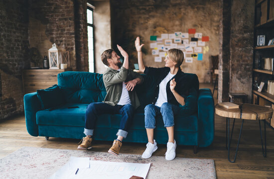 Couple examines charts on laptop together, highlighting digital planning, data visualization, UX review, tech collaboration, user‑centered design, analytics insight, interactive problem‑solving