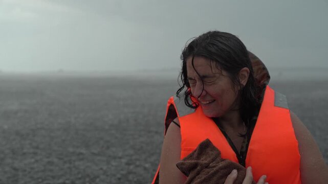 Woman rowing boat in storm with pet, struggling against elements