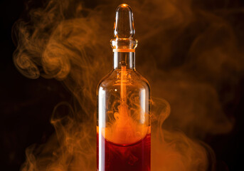 Element Bromine (Br) A dramatic photo of a sealed, thick-walled glass ampoule containing liquid bromine