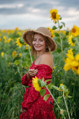 A woman walking through a field of sunflowers