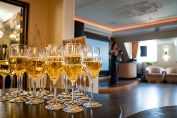 An Elegant Champagne Toast at a Celebration Event, where guests raise their glasses filled with bubbly in cheer, creating a chic atmosphere infused with joy, family, friends, and festivity