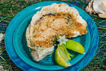 Gourmet baked oyster with herbs and cheese. Elegant seafood dish, coastal culinary delight