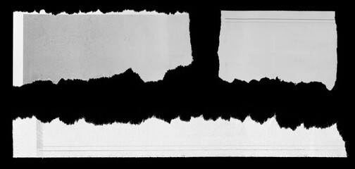 Torn papers on black