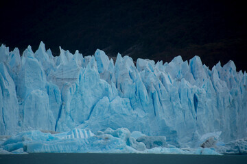 Perito Moreno glacier in Patagonia Argentina is very large and even in the rain the blue ice colors...