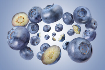 Fresh blueberries swirling in air against pale blue background