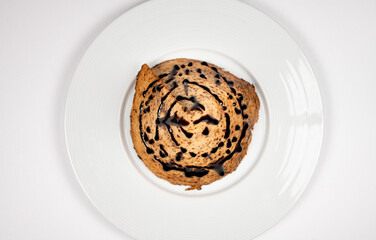 Cone-Shaped Chocolate Drizzled Dessert Cake on White Plate – Close-Up Gourmet Presentation on White Background, Top Down View