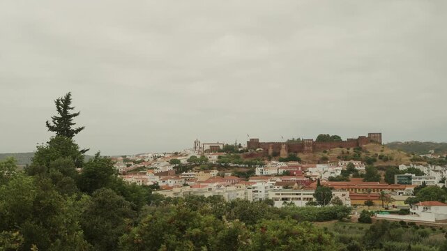 Panoramic view of Silves town with historic red sandstone castle, Algarve, Portugal