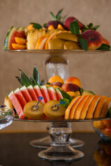 Exquisite Fresh Fruit Platter on Crystal Stand, Vibrant Watermelon, Oranges, Peaches, Pineapple,...