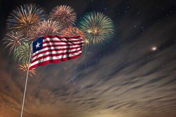 Waving National flag of Liberia and holiday fireworks