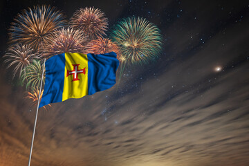 Waving National flag of Madeira and holiday fireworks