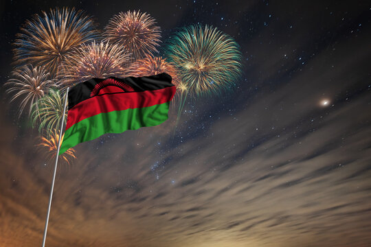 Waving National flag of Malawi and holiday fireworks