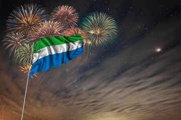 Waving National flag of Sierra Leone and holiday fireworks