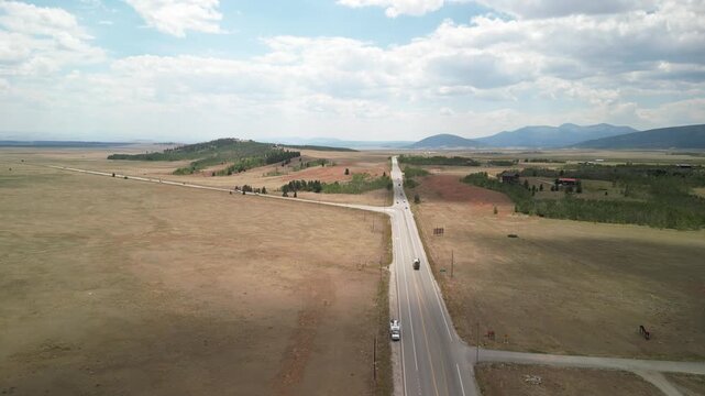 Aerial of highway 285 near Fairplay Colorado small town in summer