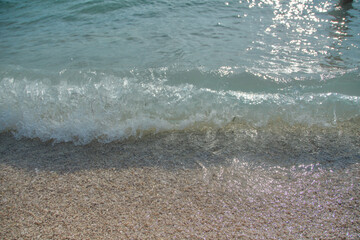 Adriatic sea surf water wave on pebble beach in Croatia