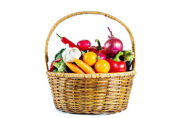 Fresh shiny multi-colored vegetables in a wicker basket.