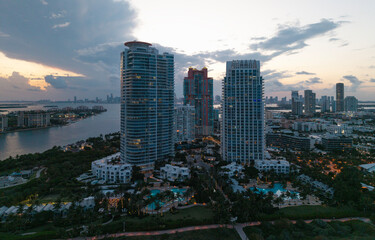 Obraz premium Top view of South Miami Beach and the ocean. Miami skyline with skyscrapers. Aerial view of Miami in summer. Miami shore with luxury buildings. Scenic drone view of Miamis famous coastline.
