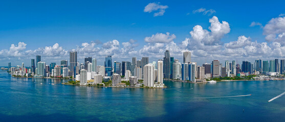 Fototapeta premium Aerial panorama of Brickell in Miami. Downtown Miami skyline on a sunny day. Scenic view of Miami Beach and Brickell. Brickell famous landmarks. Miami downtown landscape.