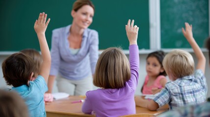 Enthusiastic young students raise hands in a bright classroom. A kind female teacher guides eager children. Learning and growth thrive in this educational setting.