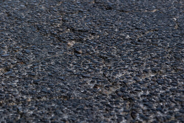 Industrial concrete surface close-up, capturing grit, wear, and weathered patterns in high...