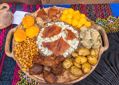 Traditional dishes of Ecuadorian highlands: toasted corn, mote (cooked mature corn), hornado or chancho asado (grilled pork), fritada de chancho (pork fry-up), potato balls, pig's skin, whole potatoes