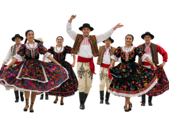A joyful group of folk dancers in vibrant, traditional costumes performing a cultural dance together on a white background