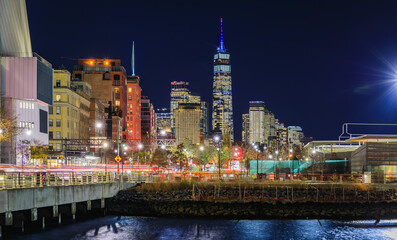 The illuminated cityscape and skyline of Lower Manhattan at night in New York NY