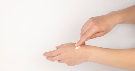 Hand with cream. Gentle female hands. Concept of skin care and cosmetic products.