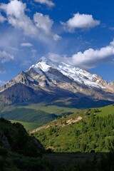 Mountain landscape with blue sky and clouds