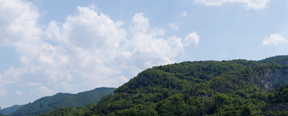Rhodopes, are a mountain range in Southeastern Europe. Bulgaria. Panorama. The forest area covers the mountains.