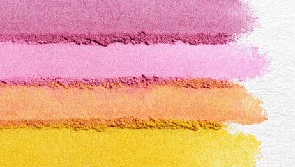 Four horizontal swathes of finely-ground pigmented powder in shades of deep rose, light pink, peach, and gold, set against a textured white background