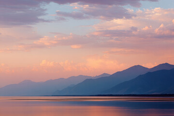 breathtaking sunset over lake baikal where sky meets water in mesmerizing display