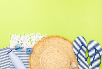 Blue beach accessories on color background, top view. Copy space for text