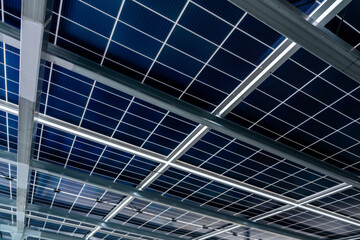 Low angle view of Solar panel electric system on infrastructure building exterior skyscraper...