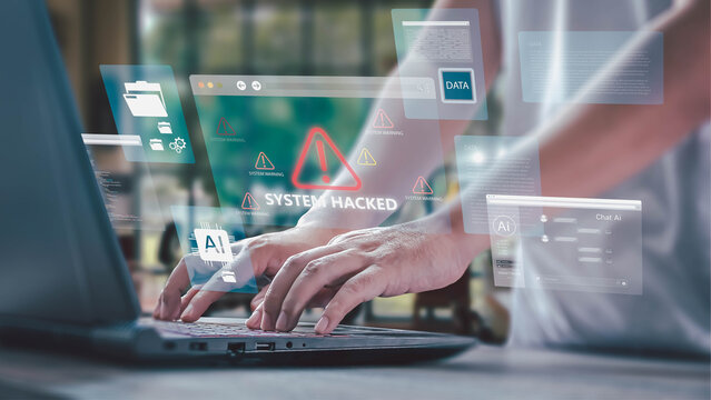 A person types on a laptop with a holographic interface showing a "SYSTEM HACKED" alert, symbolizing a cybersecurity breach, data theft, and AI technology risks in a modern office.